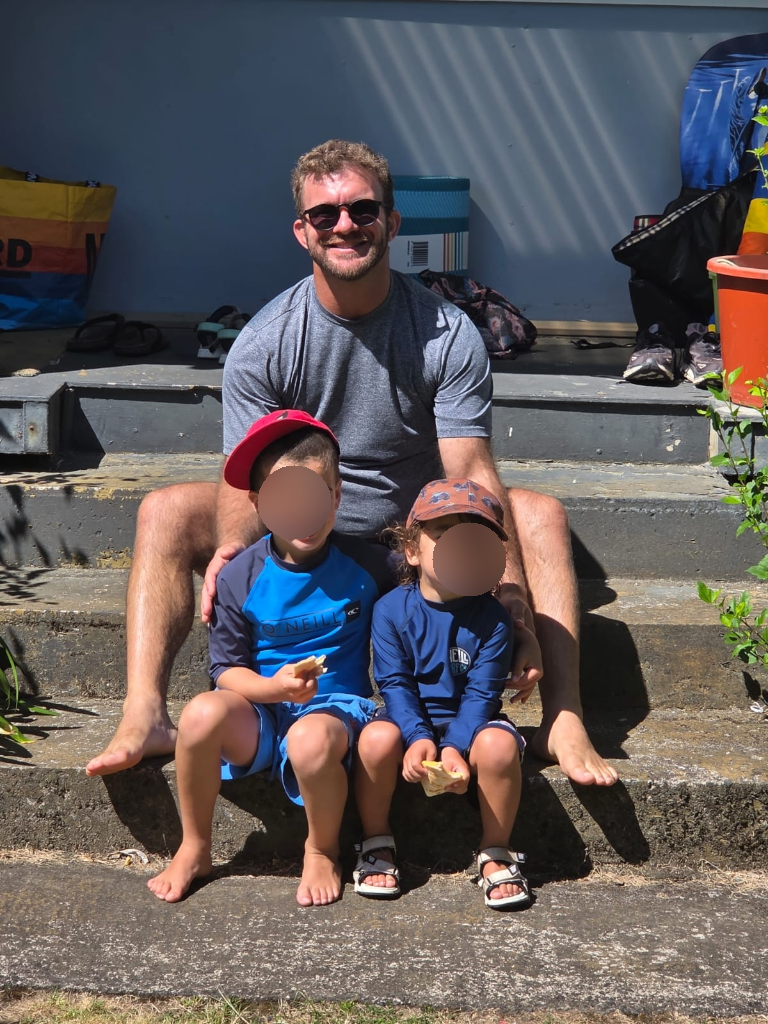 Matt O'Sullivan with family at a construction site