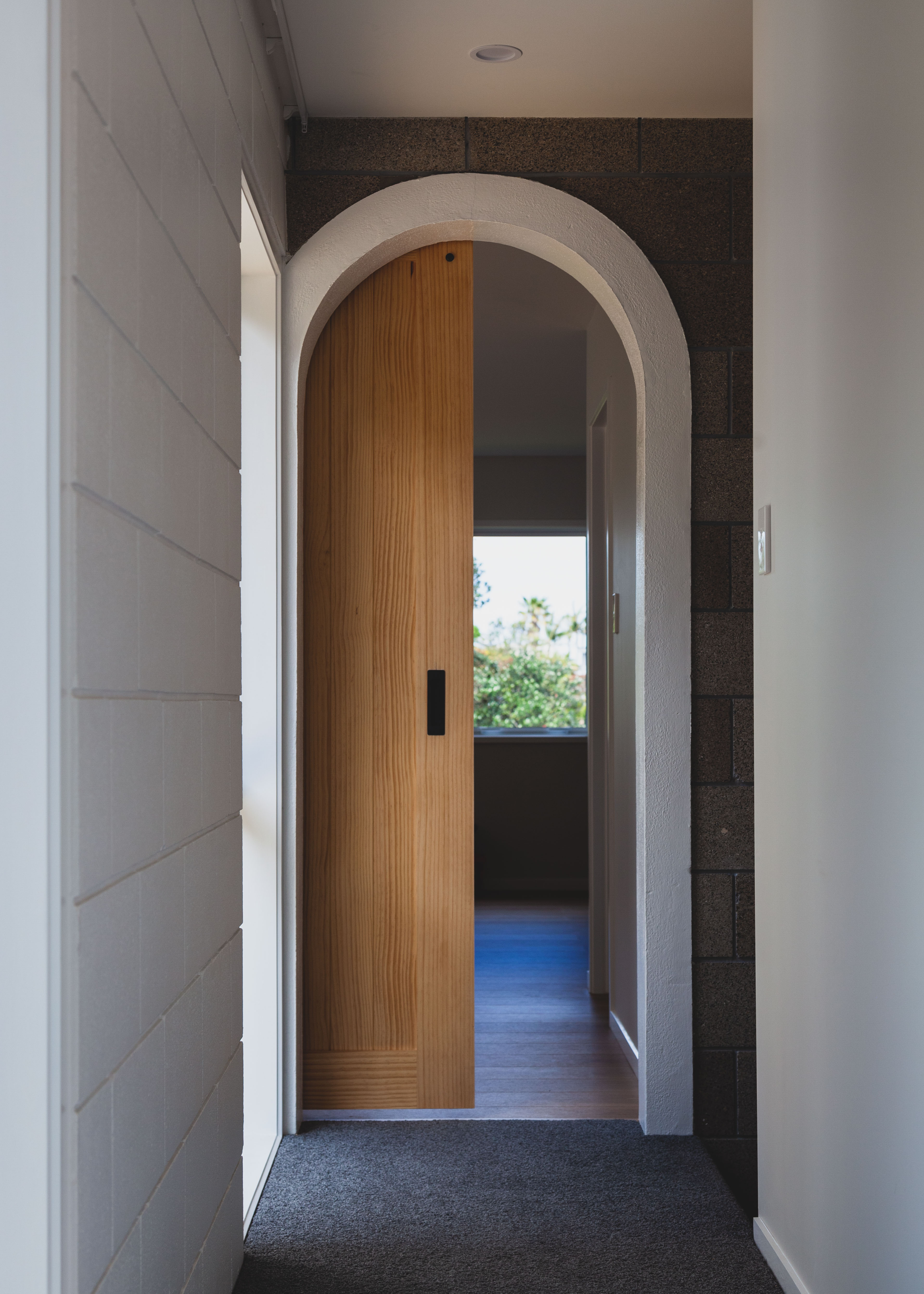 Arched doorway with wooden door